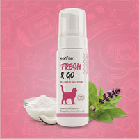 Earthzen Fresh & Go dry bath for cats and kittens on a pink background with cat-themed illustrations.